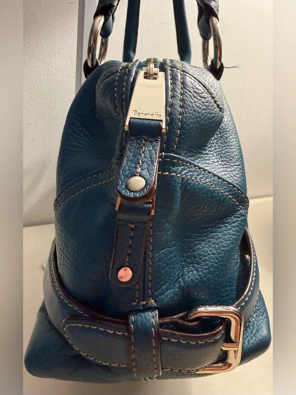 Tignanello teal blue pebbled leather satchel with silver toned hardware.
